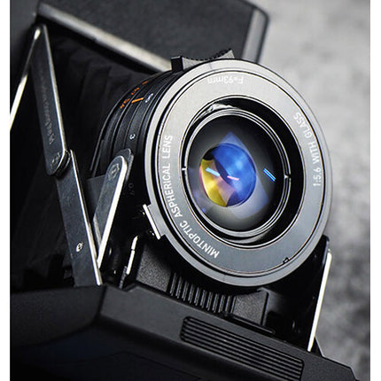 Mint Camera InstantKon RF70 Cámara de Foto Instantánea con Lente 93mm y Apertura Ajustable